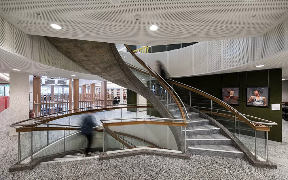 Vogl Perforated Acoustical Drywall Ceiling and Walls at an open stairwell. Pattern 8-18R