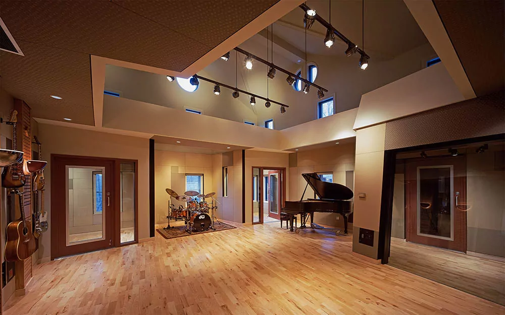 QuietSwing Acoustical STC Doors with full lite glass and sidelites in a recording studio live practice room.