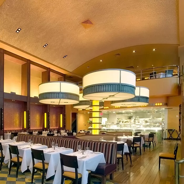 Pigmented Acoustement acoustic plaster spray applied to the ceiling of a large restaurant