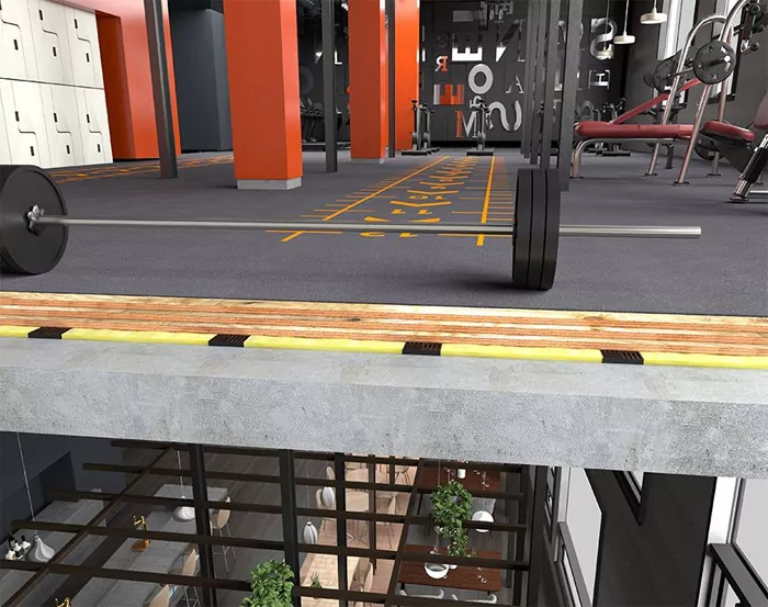 MetaWrx weight drop vibration isolator beneath a floating floor in a gym