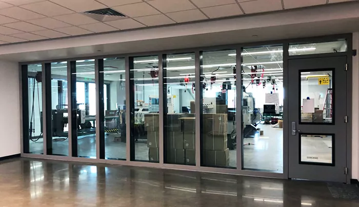 QuietLite STC Rated Window with mullions between fabrication shop and office space