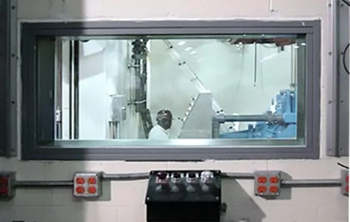 QuietLite STC rated observation window for equipment room at a manufacturing plant.