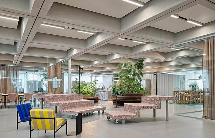 dur-solo metal acoustical ceiling clouds with integrated linear lighting installed in a concrete waffle ceiling
