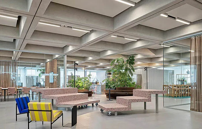 dur-solo metal acoustical ceiling clouds with integrated linear lighting installed in a concrete waffle ceiling
