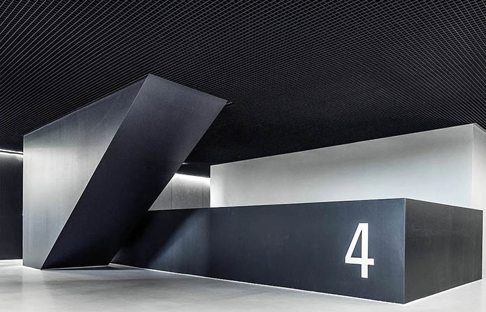 Black square open cell metal ceilings in a modern open plan environment