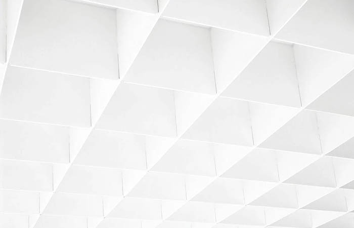 Detailed view of a single blade rectangular metal open cell suspended ceiling in white coated finish