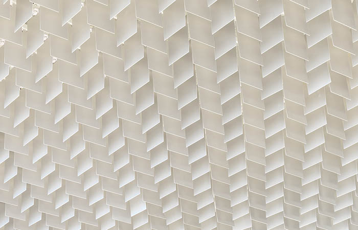 Close up view of LIVA metal blade open cell ceiling in white.