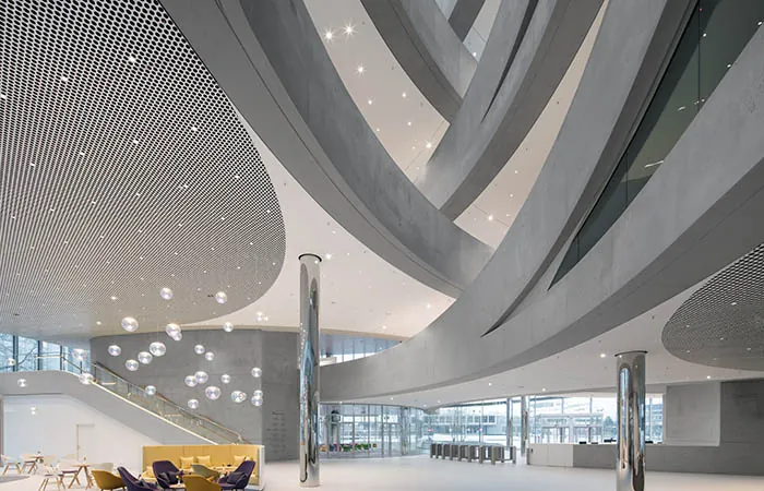 Loop open metal ceiling with integrated lighting in a corproate lobby