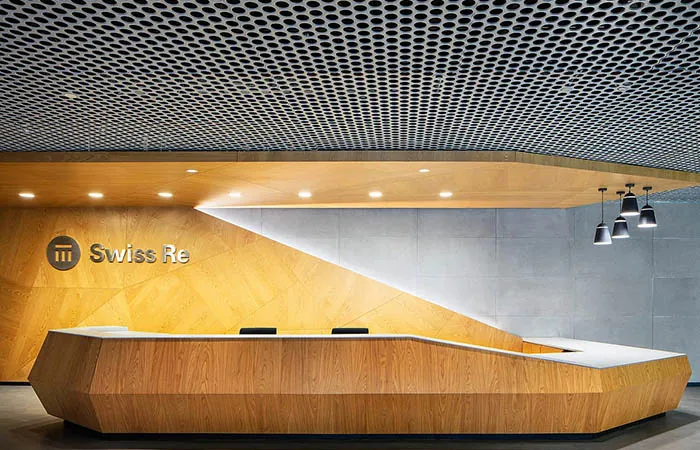 Loop open cell metal ceiling at a lobby desk
