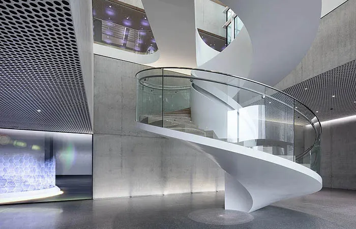 Loop metal ceiling at circulation around an open stairwell