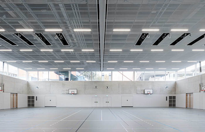 Rhombos expanded metal ceiling in a basketball court gymnasium.