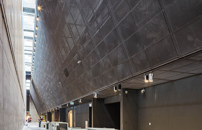 Expanded metal mesh decorative ceiling in a circulation atrium.
