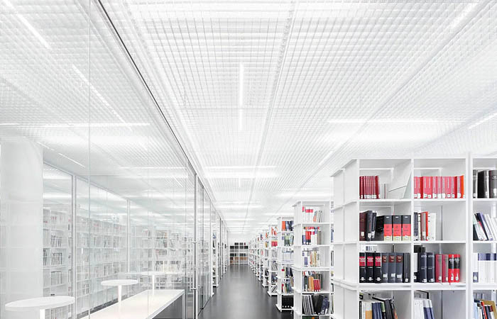 White Ticell-N open cell woven metal ceiling throughout a library with light diffusion